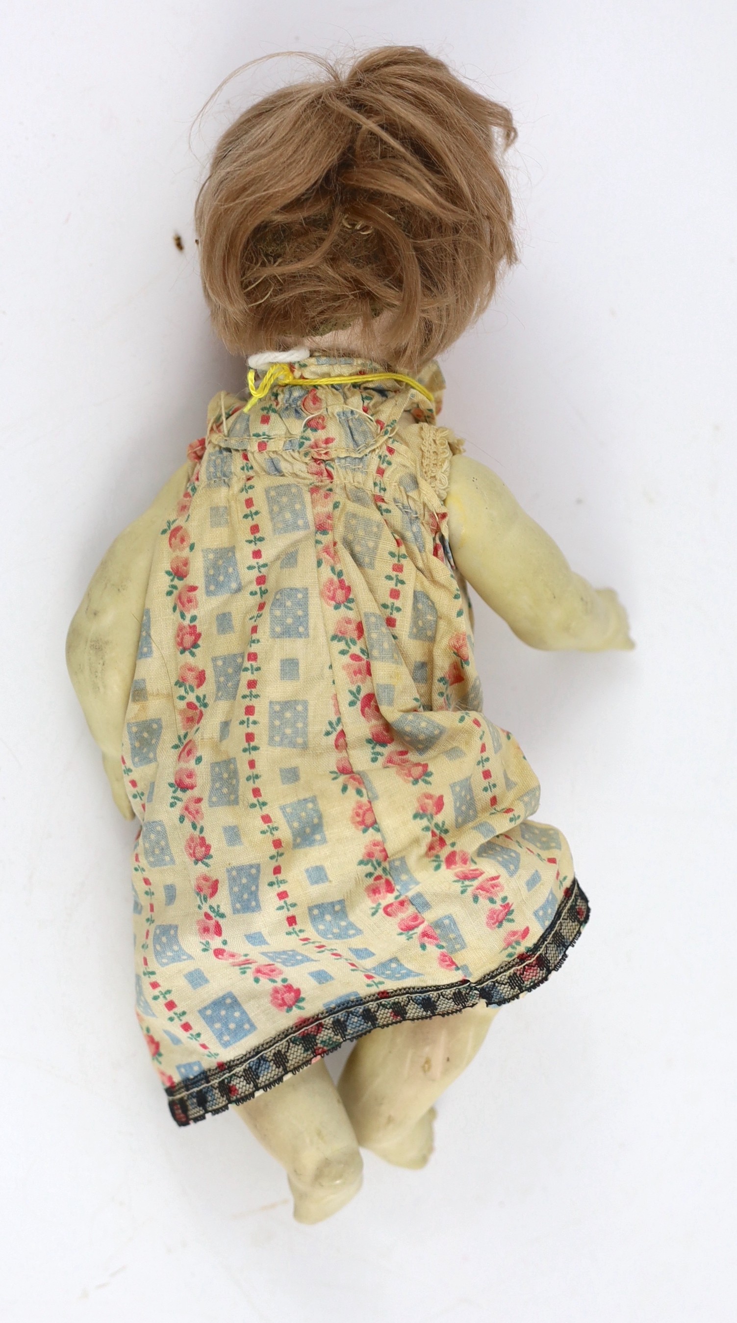 A bisque doll, German, circa 1914, 11in.